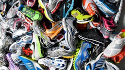 A pile of running shoes from many companies A pile of running shoes from many companies