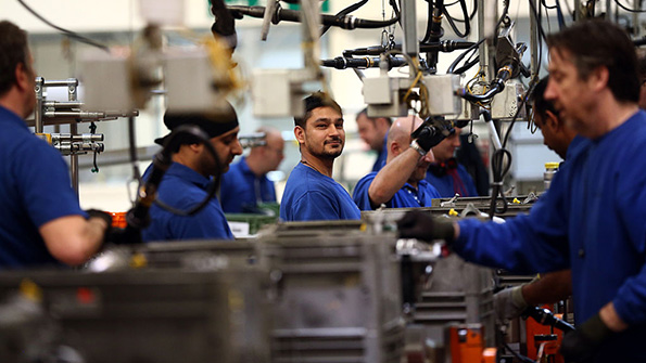 The line works on an engine at a Ford plant in Dagenham England