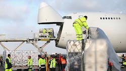 Airport workers load cargo through the nose of a Boeing 747 Airport workers load cargo through the nose of a Boeing 747