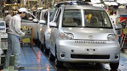 Line workers assemble Toyota cars at the companys Takaoka plant Line workers assemble Toyota cars at the companys Takaoka plant