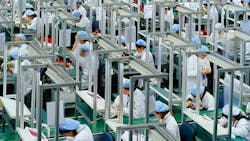 Workers in a Chinese factory Workers in a Chinese factory