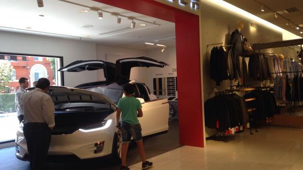 Teslarsquos minishowroom next to menrsquos clothing department at LAarea Nordstrom