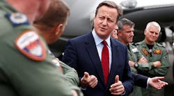 British Prime Minister David Cameron talks with aircrew Monday at the Farnborough International Airshow in England. Among the many deals already announced, the British government will purchase nine new marine patrol planes from Boeing for 3 billion pounds, about $3.89 billion.