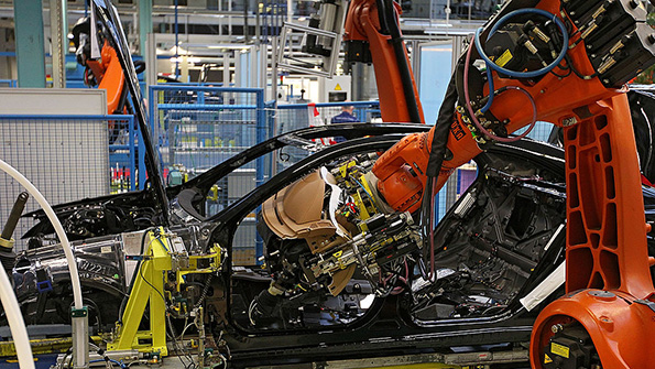 A Kuka robotic arm installs a dashboard on a Daimler AG MercedesBenz SClass at the companyrsquos plant in Sindelfingen