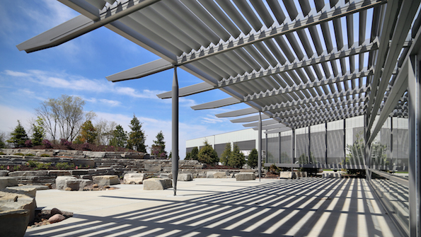 Terraced landscaping and an attractive trellis provide a welcoming outdoor cafeteriagathering space for employees at the Rockford building