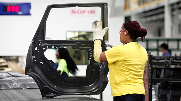 A worker at the Fiat Chrysler Automobiles US Warren Stamping Plant in Michigan