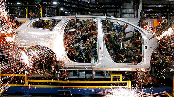 A GM vehicle on the robotic assembly line in Lansing Michigan