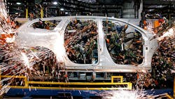 A GM vehicle on the robotic assembly line in Lansing Michigan A GM vehicle on the robotic assembly line in Lansing Michigan