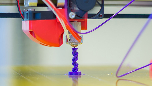 A 3D printer makes a vertical part