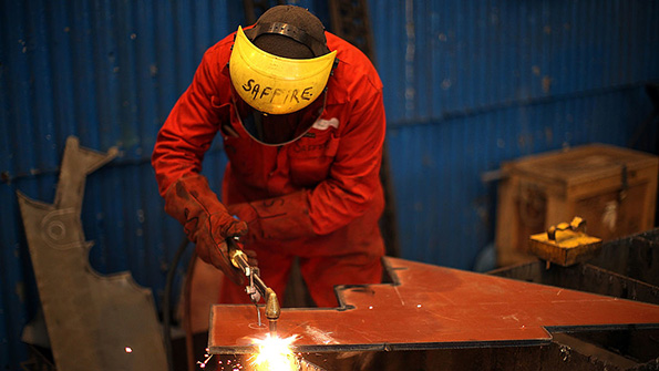 A worker at the Cammel Laird shipyard