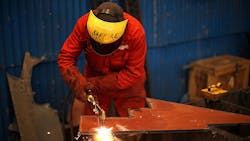 A worker at the Cammel Laird shipyard A worker at the Cammel Laird shipyard