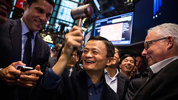 Alibaba founder and executive chairman Jack Ma bangs the gavel at the NYSE