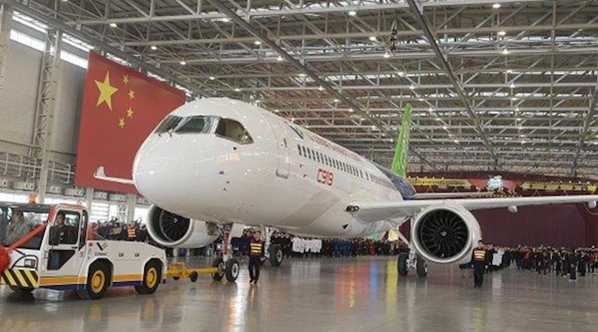 China&apos;s first self-developed large passenger jetliner C919 is presented after it rolled off the production line at Shanghai Aircraft Manufacturing Co., Ltd on November 2, 2015 in Shanghai, China.