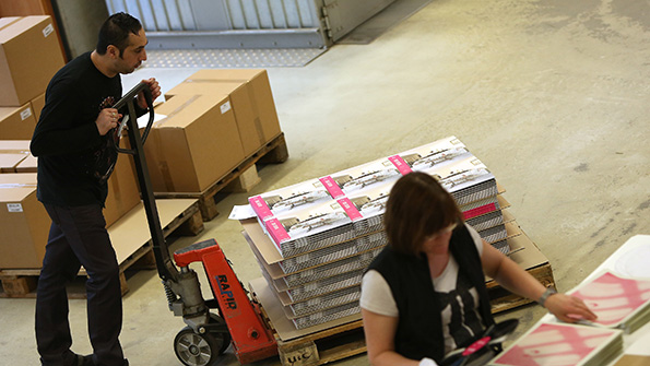 German workers package vinyl records bound for the supply chain