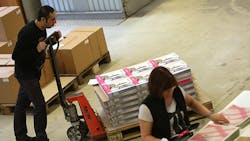 German workers package vinyl records bound for the supply chain German workers package vinyl records bound for the supply chain