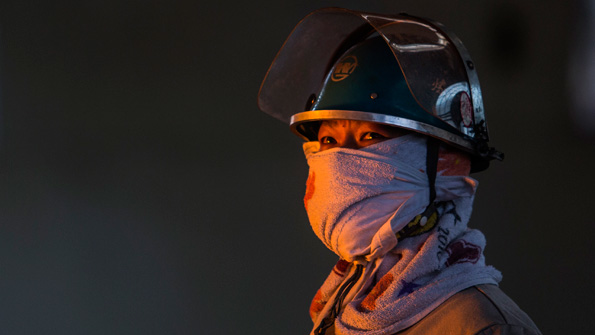 WUHAN CHINA AUGUST 27 A worker supervises the production of molten iron at a furnace in the production area of the Wuhan Iron amp Steel Group Corp on August 27 2016 in Wuhan China The two of China39s biggest steel makers Wuhan Iron amp Steel Group Corp and Shanghai Baosteel Group Corp will be merged into Southern China Steel Group The two firms rank 11th and 15th respectively in the world
