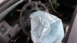 A deployed Takata airbag in a Honda sedan A deployed Takata airbag in a Honda sedan