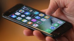 The new Apple iPhone 7 in hand The new Apple iPhone 7 in hand