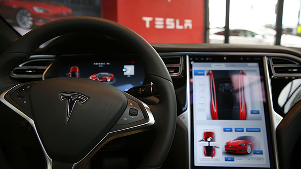 The inside of a Tesla vehicle at a New York showroom
