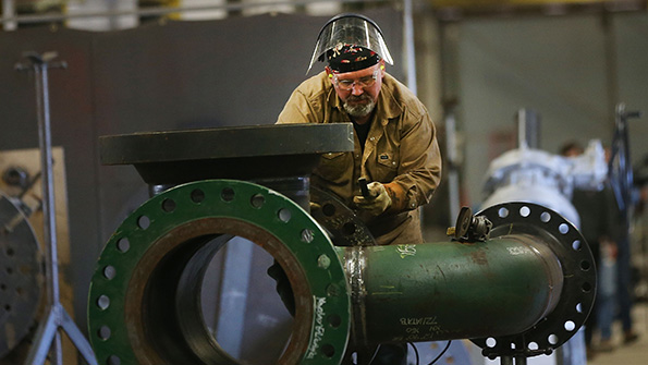 An employee works at Pioneer Pipe in Marietta Ohio