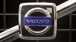 The Volvo logo on the grille of a car The Volvo logo on the grille of a car