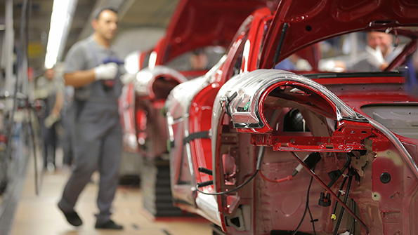 Au auto worker on the factory floor