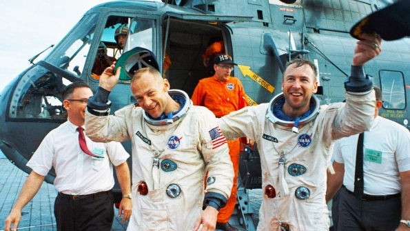 Copilots Jim Lovell and Buzz Aldrin celebrate after the Gemini XII splashdown on November 15 1966