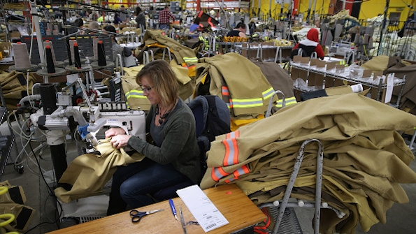 Employees of Globe Manufacturing in New Hampshire assemble firefighting clothing and gear