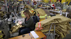 Employees of Globe Manufacturing in New Hampshire assemble firefighting clothing and gear