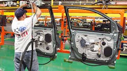 A worker assembles doors at a Ford plant in Illinois A worker assembles doors at a Ford plant in Illinois