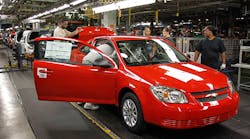Workers at the GM plant in Lordstown, Ohio, assemble a Chevy Cobalt. The Lordstown plant is one of a handful of GM locations that will be affected by job cuts next month.
