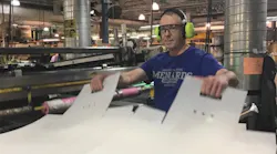 MDI employee Randy Carlson assembles postal bins