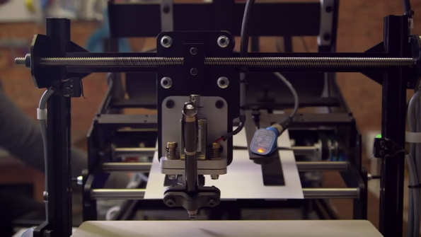 A robot writes thankyou notes at Bond