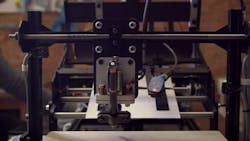 A robot writes thankyou notes at Bond A robot writes thankyou notes at Bond