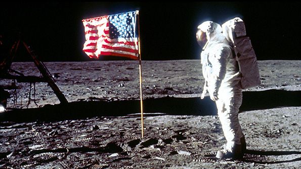 Buzz Aldrin stands next to the US flag on the Moon on July 20 1969