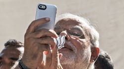 Indian Prime Minister Narendra Modi snaps a photo on his iPhone.