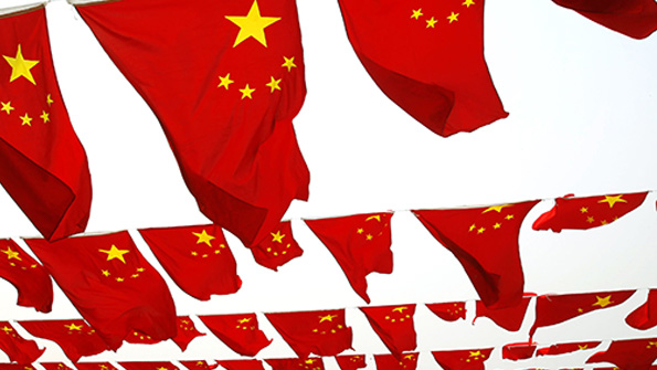 Chinese flags fly