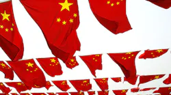 Chinese flags fly