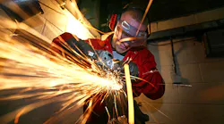 A grinding machine shop apprentice