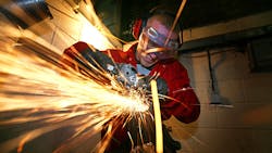 A grinding machine shop apprentice A grinding machine shop apprentice