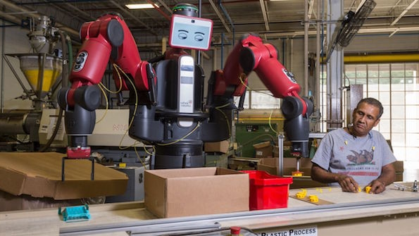 Joao Silva works with Baxter the cobot on Tinkertoys at the Rodon Group plant in Pennsylvania