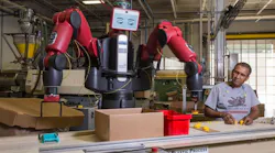 Joao Silva works with Baxter the cobot on Tinkertoys at the Rodon Group plant in Pennsylvania