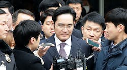 Samsung vice chairman Lee Jae-Yong, center, leaves a hearing at the Seoul Central District Court. The court had issued an arrest warrant for Lee on charges of bribery tied to the president&rsquo;s impeachment.
