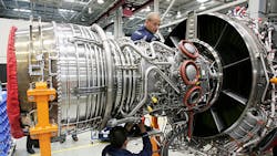 Workers assemble an aircraft jet engine at the RollsRoyce factory in Berlin Workers assemble an aircraft jet engine at the RollsRoyce factory in Berlin