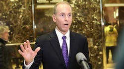 Boeing CEO Dennis Muilenburg talks with the media at Trump Tower following a meeting last month with Donald Trump.