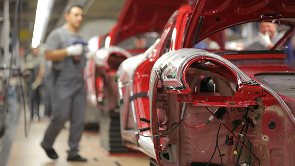 A Porsche worker at a production plant in Stuttgart