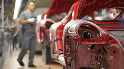 A Porsche worker at a production plant in Stuttgart