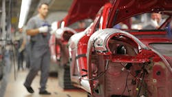 A Porsche worker at a production plant in Stuttgart A Porsche worker at a production plant in Stuttgart