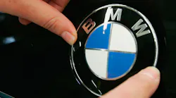 The BMW logo on a car hood