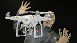 A DJI Phantom appears to fly into a crash test dummy A DJI Phantom appears to fly into a crash test dummy